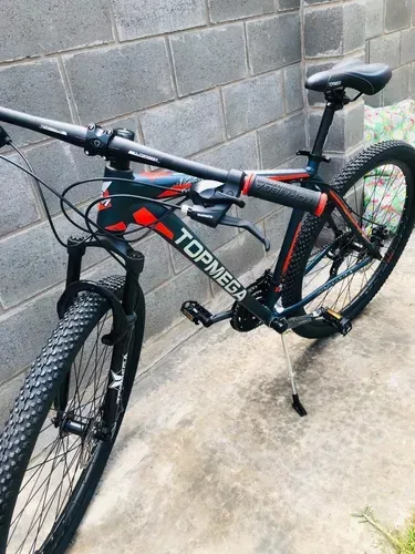 🔥Bicicleta de montaña TopMega MTB Sunshine R29 L 21v Shimano Tourney TZ31 Frenos de disco mecánicos y manetas de cambio Shimano Tourney Azul claro